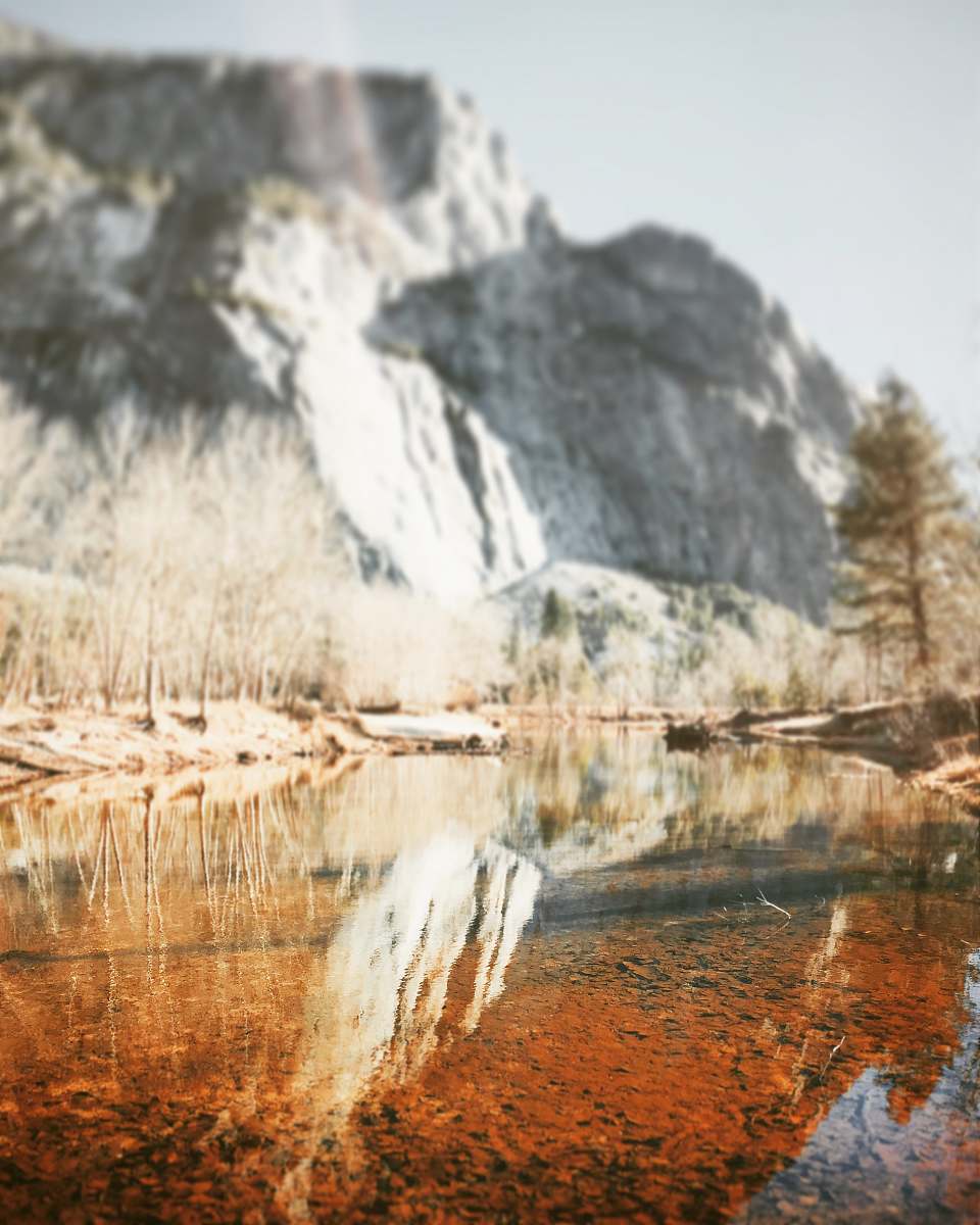 iphone wallpapers reflection of rock cliff on calm river water iphone backgrounds